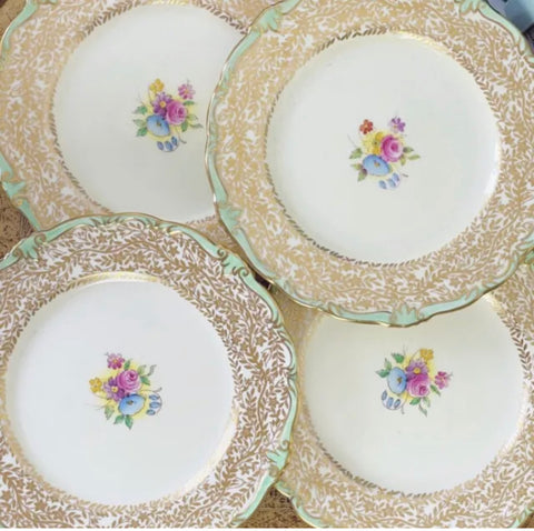 Set of four Paragon tea plates, handpainted flowers and filigree gilding