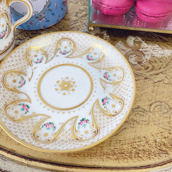 Brown Westhead Moore teacup and saucer set, gilded and handpainted rose swags