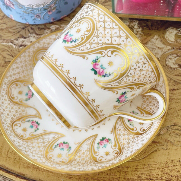 Brown Westhead Moore teacup and saucer set, gilded and handpainted rose swags