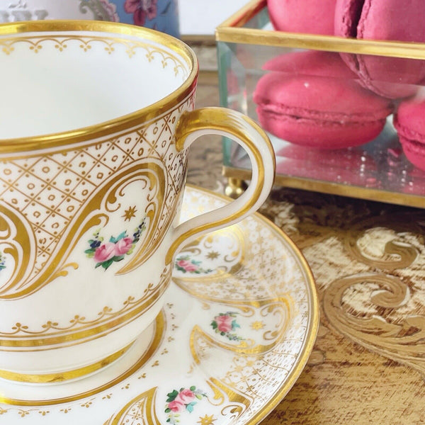 Brown Westhead Moore teacup and saucer set, gilded and handpainted rose swags