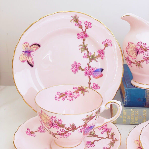 Tuscan tea set items, pink ground, butterfly design, trios, milk jug, sugar bowl