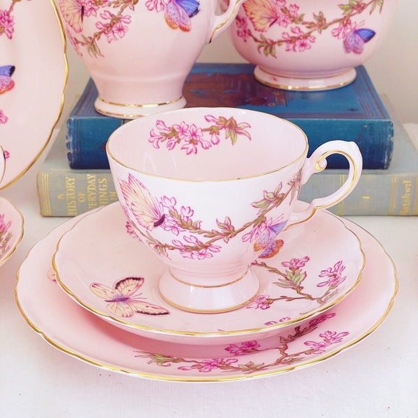 Tuscan tea set items, pink ground, butterfly design, trios, milk jug, sugar bowl