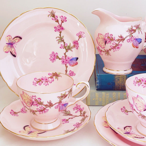 Tuscan tea set items, pink ground, butterfly design, trios, milk jug, sugar bowl