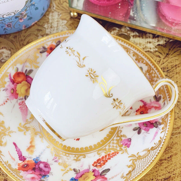 Antique Coalport Empire shape cup and saucer, c1820, handpainted flowers.