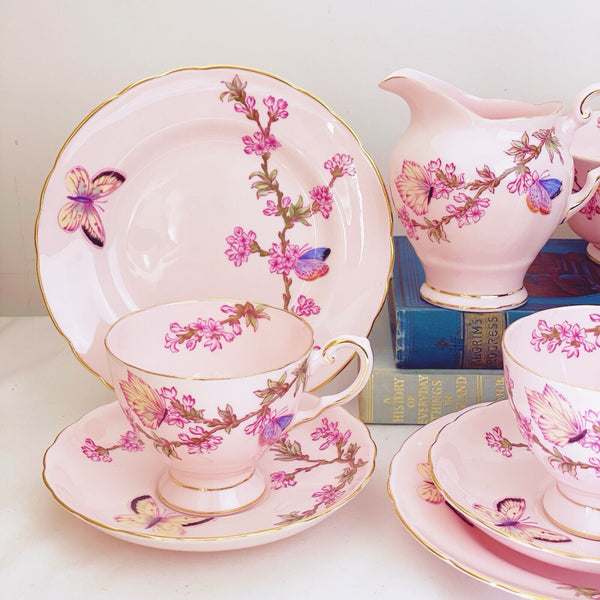 Tuscan tea set items, pink ground, butterfly design, trios, milk jug, sugar bowl