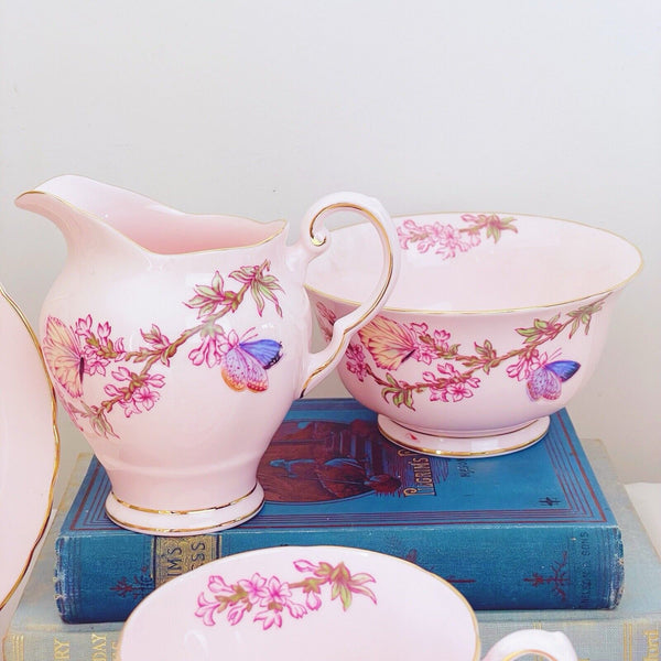 Tuscan tea set items, pink ground, butterfly design, trios, milk jug, sugar bowl