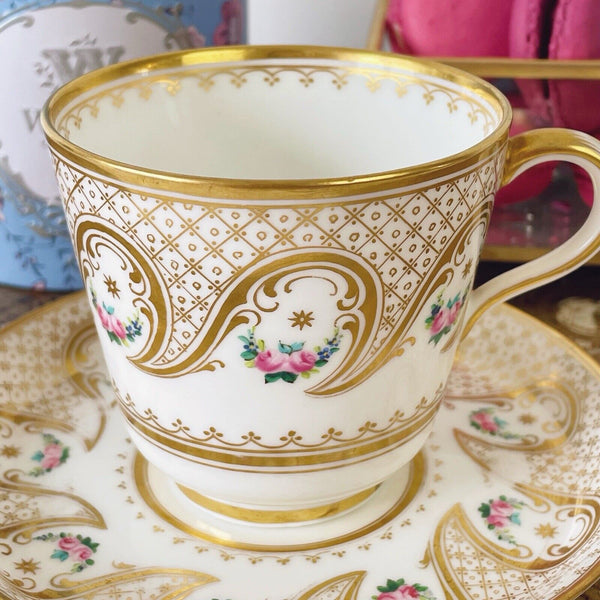 Brown Westhead Moore teacup and saucer set, gilded and handpainted rose swags