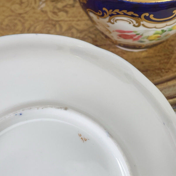 An antique Coalport cup and saucer, handpainted flowers, cobalt blue