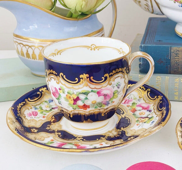 Pair of antique Coalport cups and saucer, handpainted flowers, cobalt blue