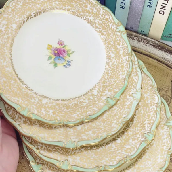 Set of four Paragon tea plates, handpainted flowers and filigree gilding