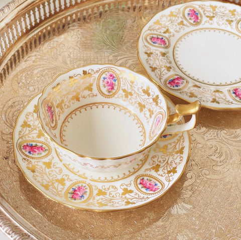Antique Cauldon teacup trio with gilded vine leaves and pink rose cameos