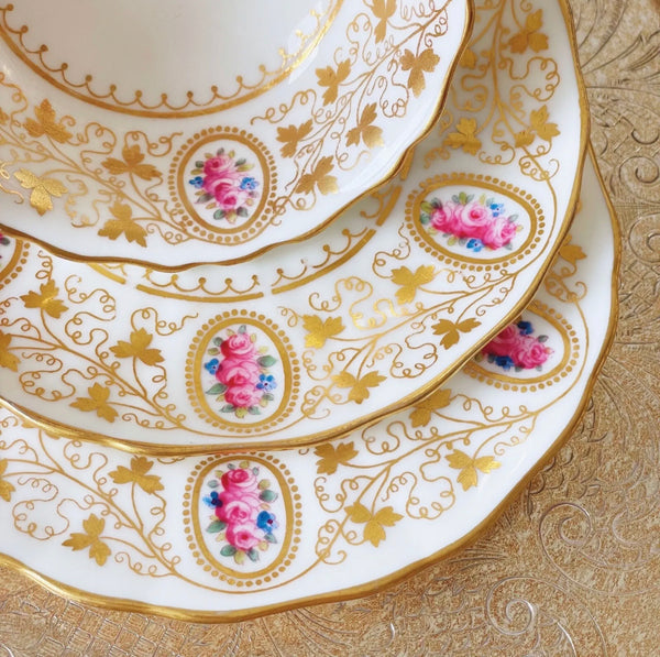 Antique Cauldon teacup trio with gilded vine leaves and pink rose cameos