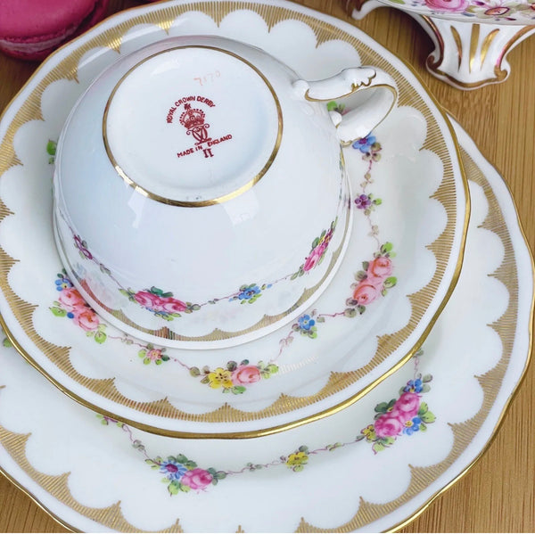 Antique Royal Crown Derby handpainted teacup trio, flowers and gilding