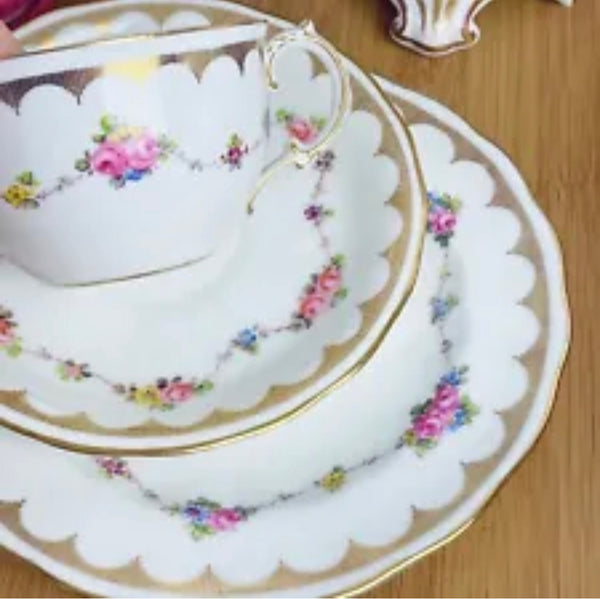 Antique Royal Crown Derby handpainted teacup trio, flowers and gilding
